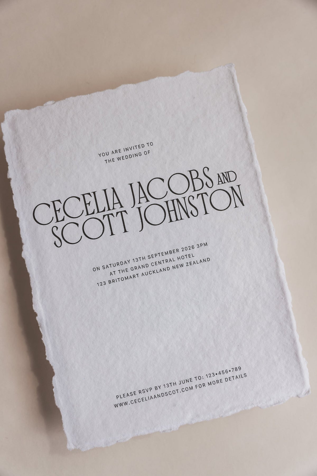 Cecelia wedding invitation showing organic deckled edge paper texture