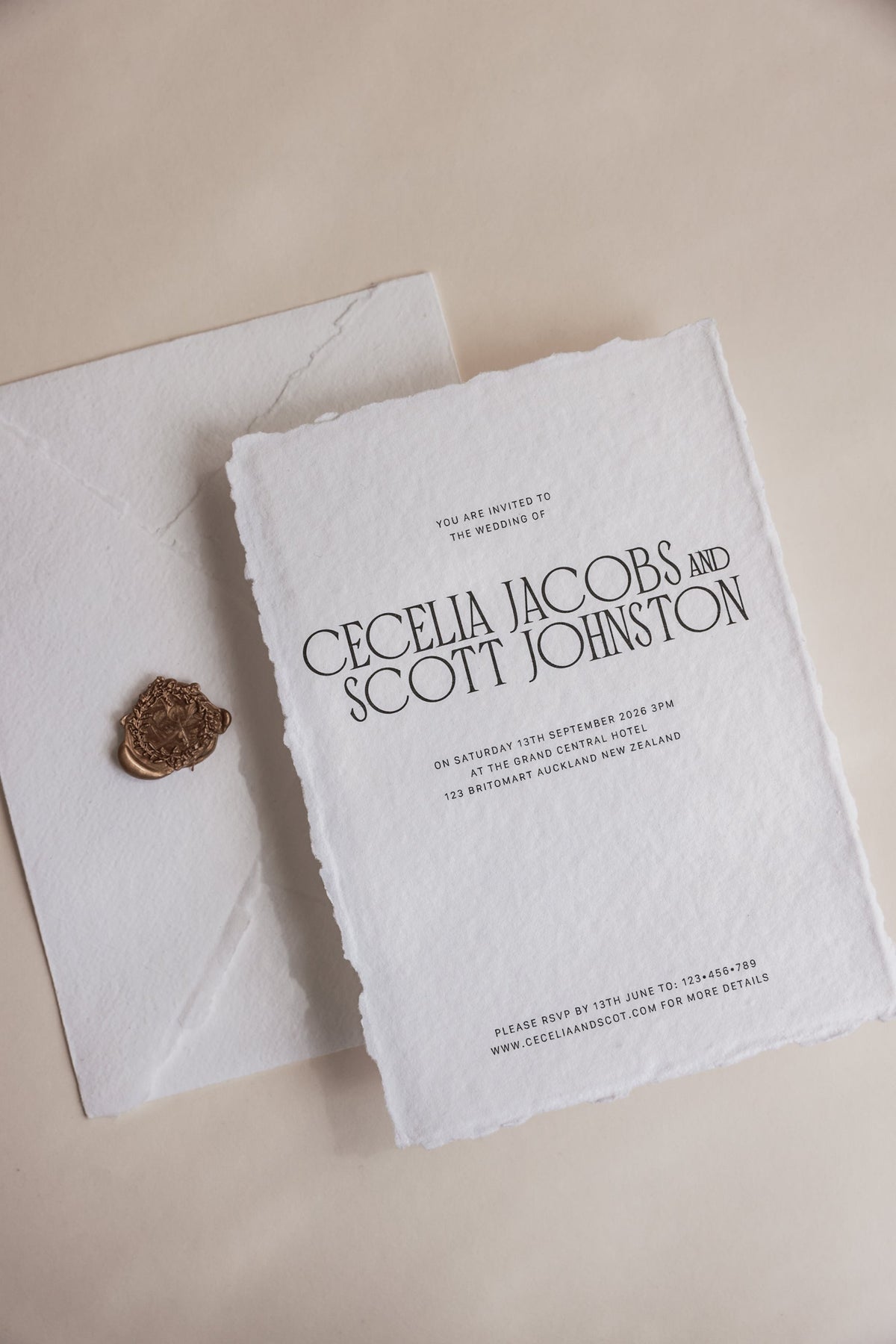 Cecelia minimalist wedding invitation styled flat lay on handmade paper